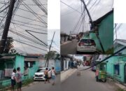 Kabel Semrawut dan Tiang Miring di Karawang Wetan Ancam Keselamatan Pengguna Jalan